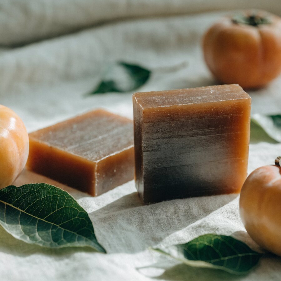 Two triple-milled bars, pressed hard so each one lasts a month instead of a fortnight.
